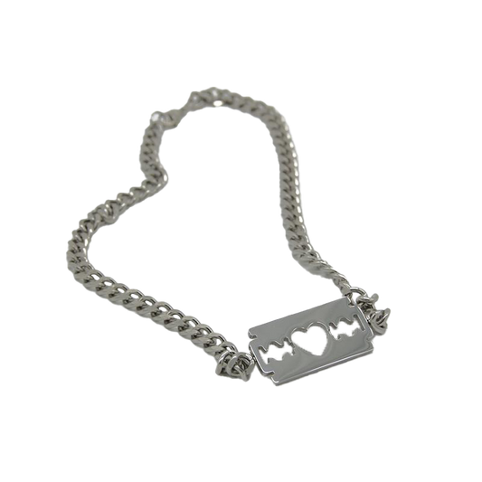 A commemorative necklace celebrating the twenty fifth anniversary of Razorblade Romance. A thick stainless steel chain with a razor blade pendant at the middle.